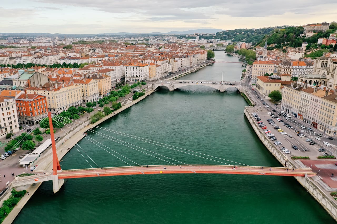 services-04 A scenic aerial view of Lyon, France featuring Saone River and iconic bridges.